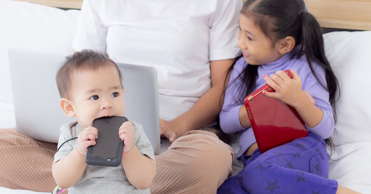 children using phones and tablets